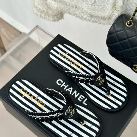 CHANEL Striped flip-flops